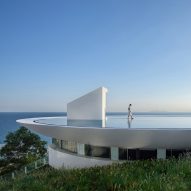 3andwich Design tops clifftop library in China with circular pool