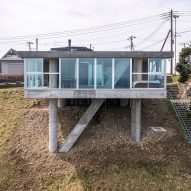 Noriaki Hanaoka Architecture perches Torus House on sloping site in Japan
