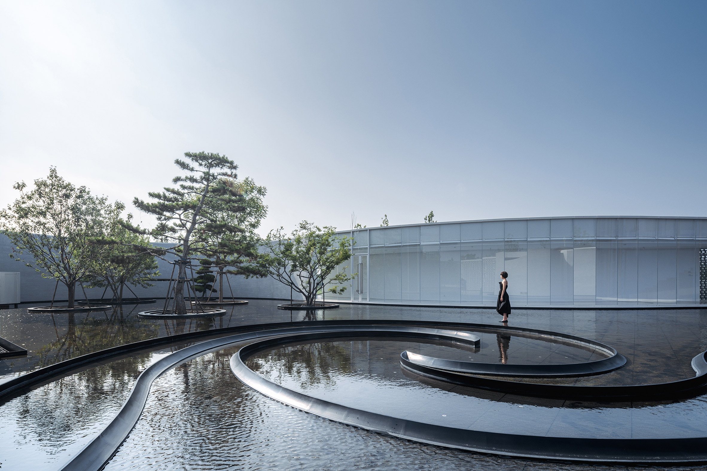 Curved water feature in museum complex in China