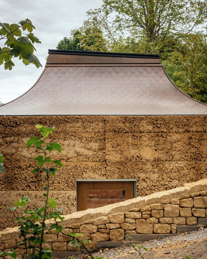 Rammed-earth facade of yoga studio at The Newt in Somerset