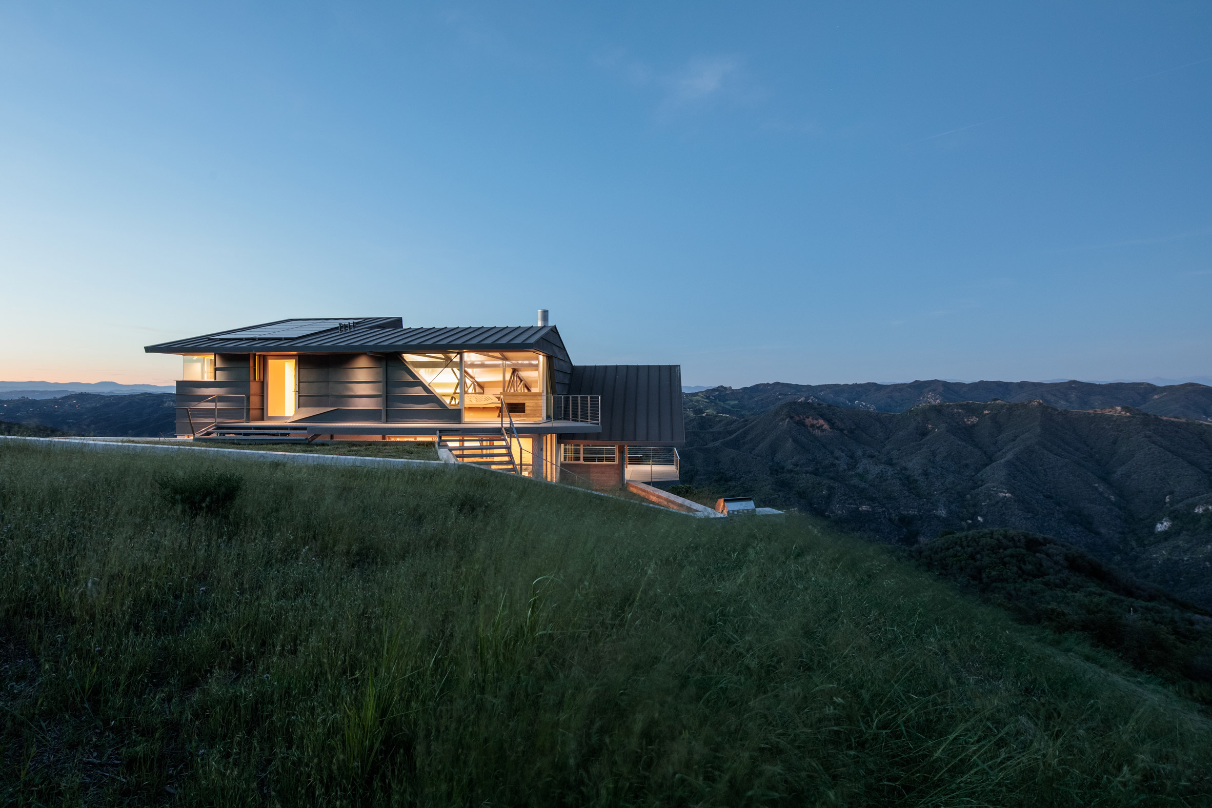 A house on a hill by Deegan Day Design