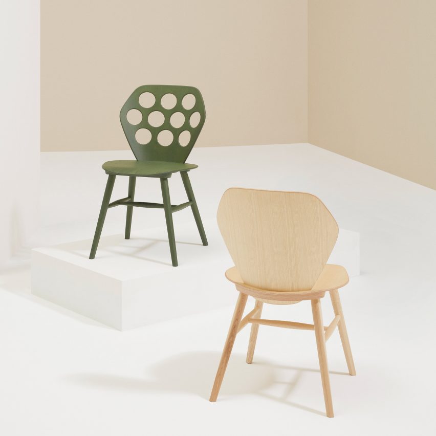 Green and natural wooden chairs by Billiani in a neutral showroom space