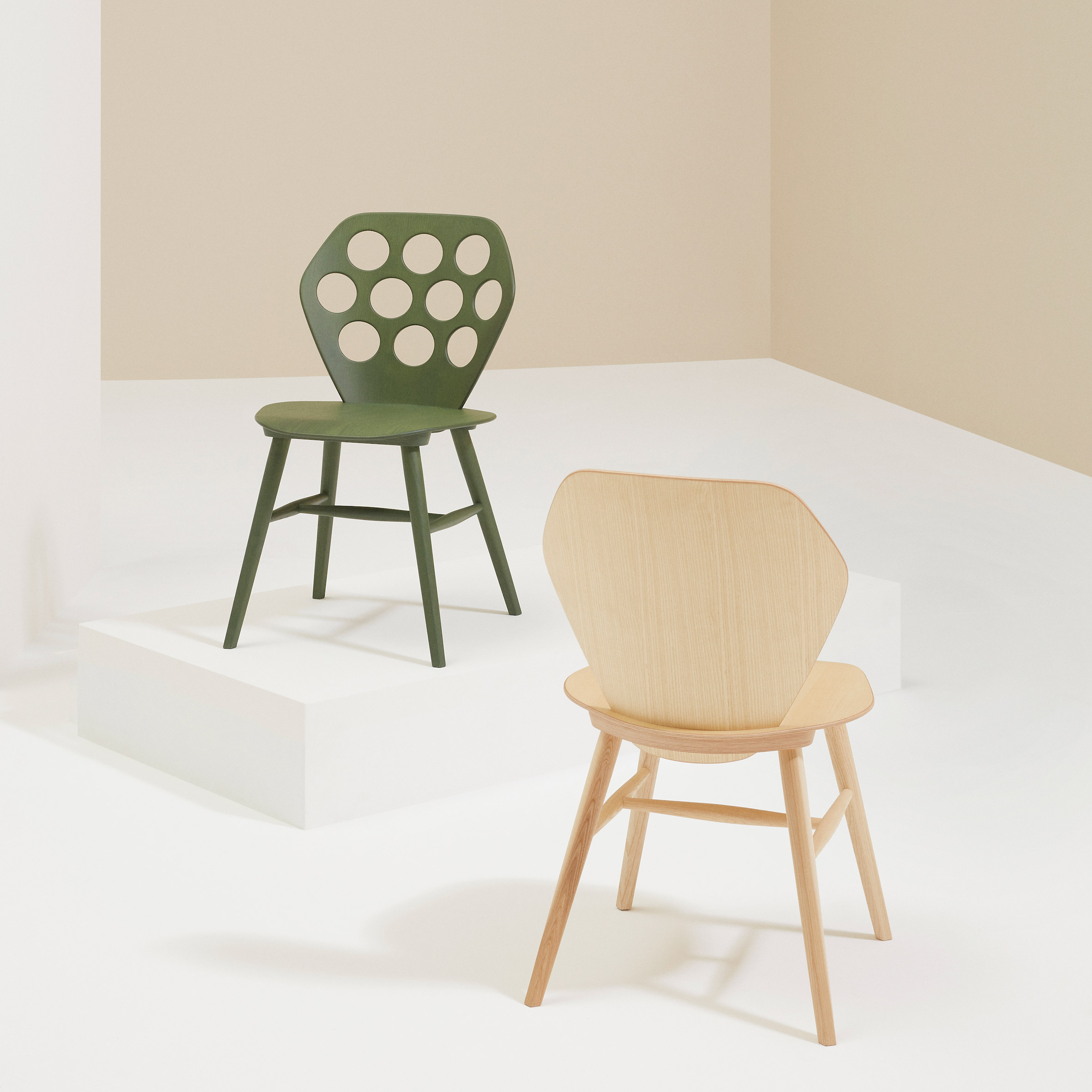 Green and natural wood chairs by Billiani in a neutral showroom space