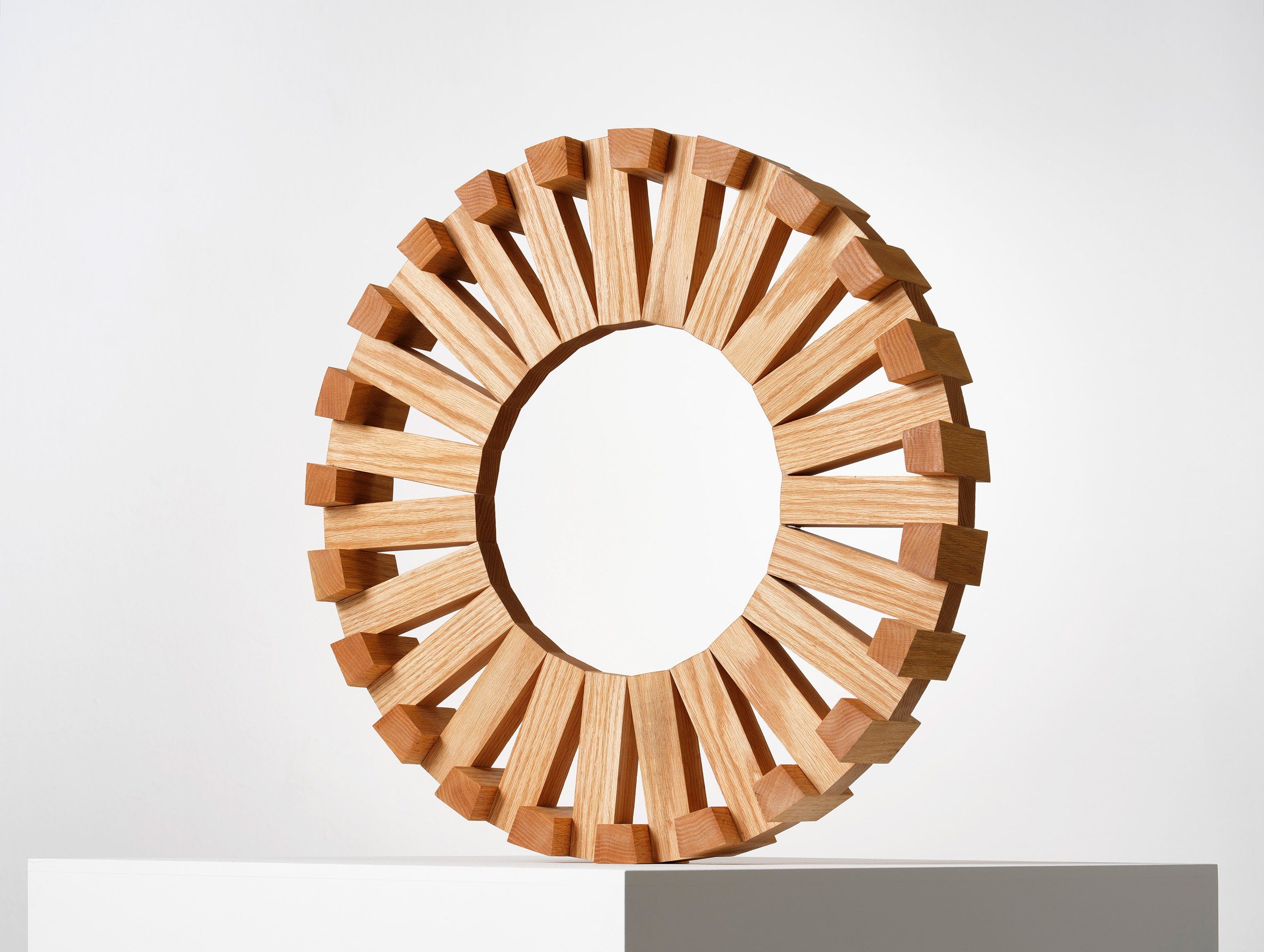 Red Oak Circuit, a wooden sculptural form in a gallery