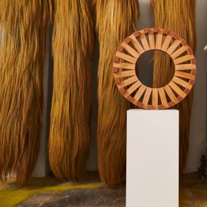 Red Oak Circuit, a wooden sculptural form in a gallery