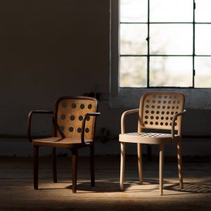 Two wooden chairs placed next to each other