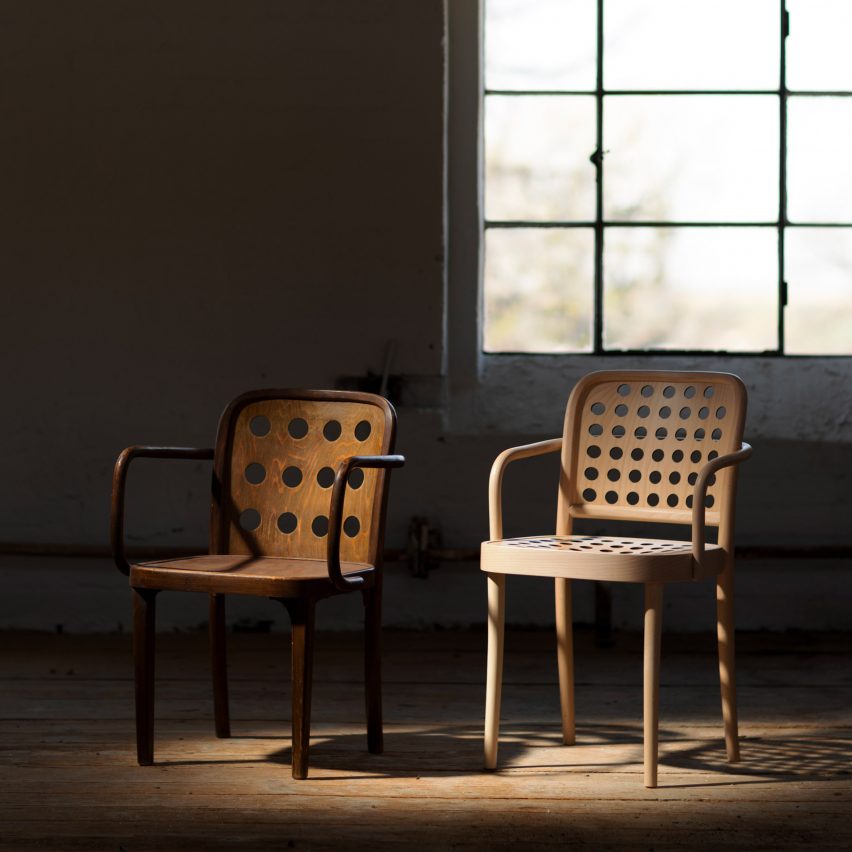 Two wooden armchairs placed next to each other
