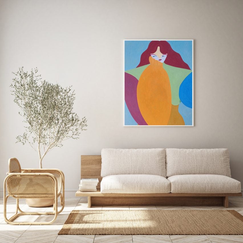 A minimalist living room with a hanging artwork