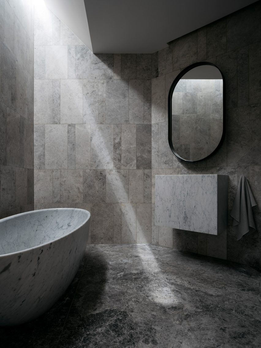 Interior image of a stone bathroom at the Sydney home