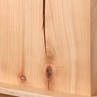 Photograph showing detail of raw cherry wood with split and knots in wood grain