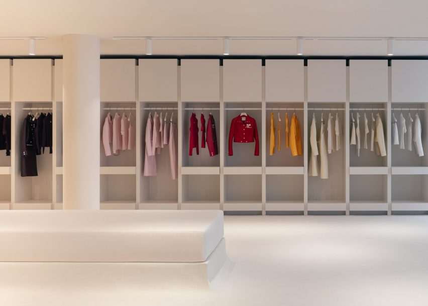 Interior image of clothing organised in pocket shelving