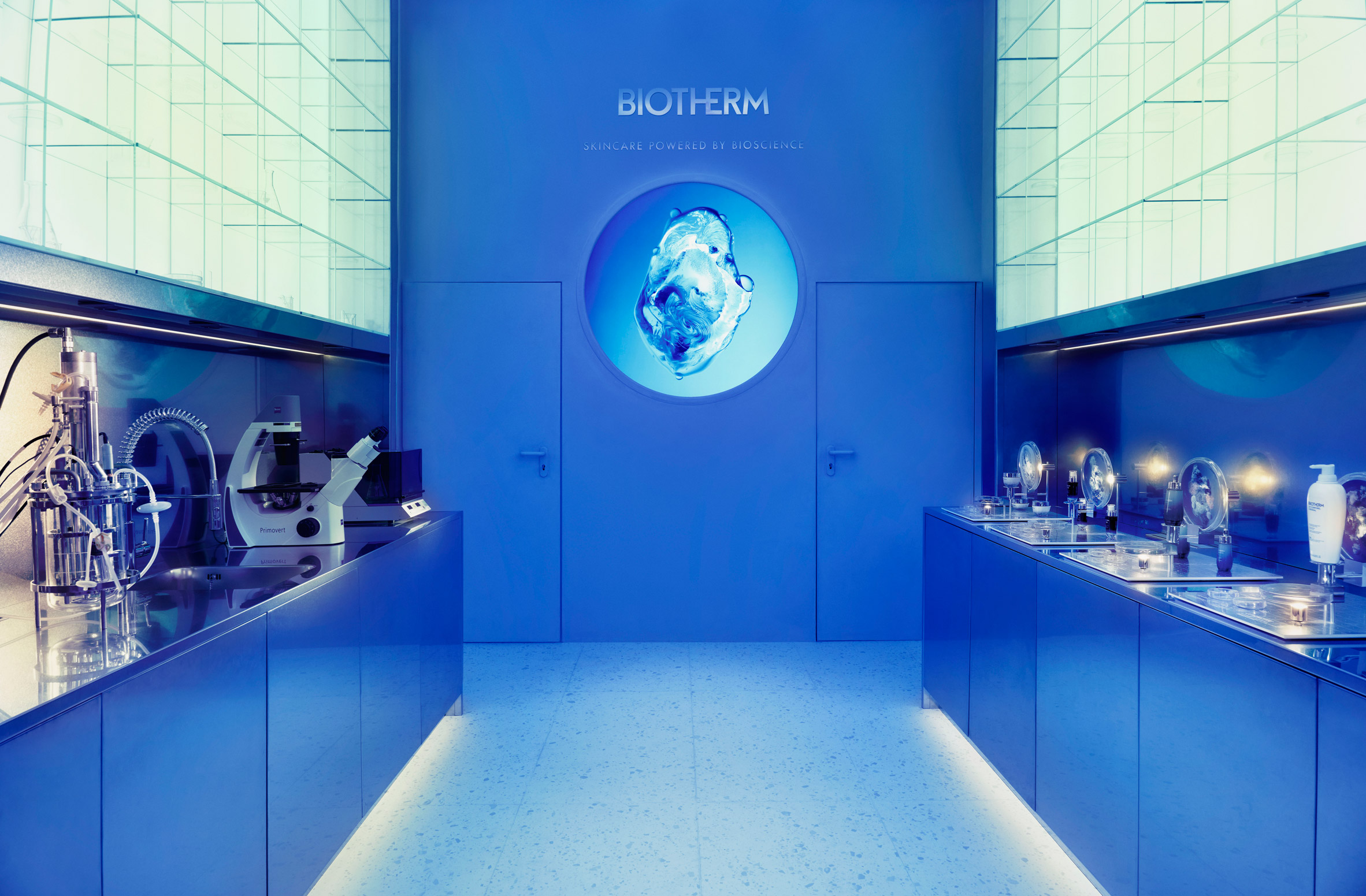 Biotherm concept store in Monaco has blue interiors with science lab-inspired details