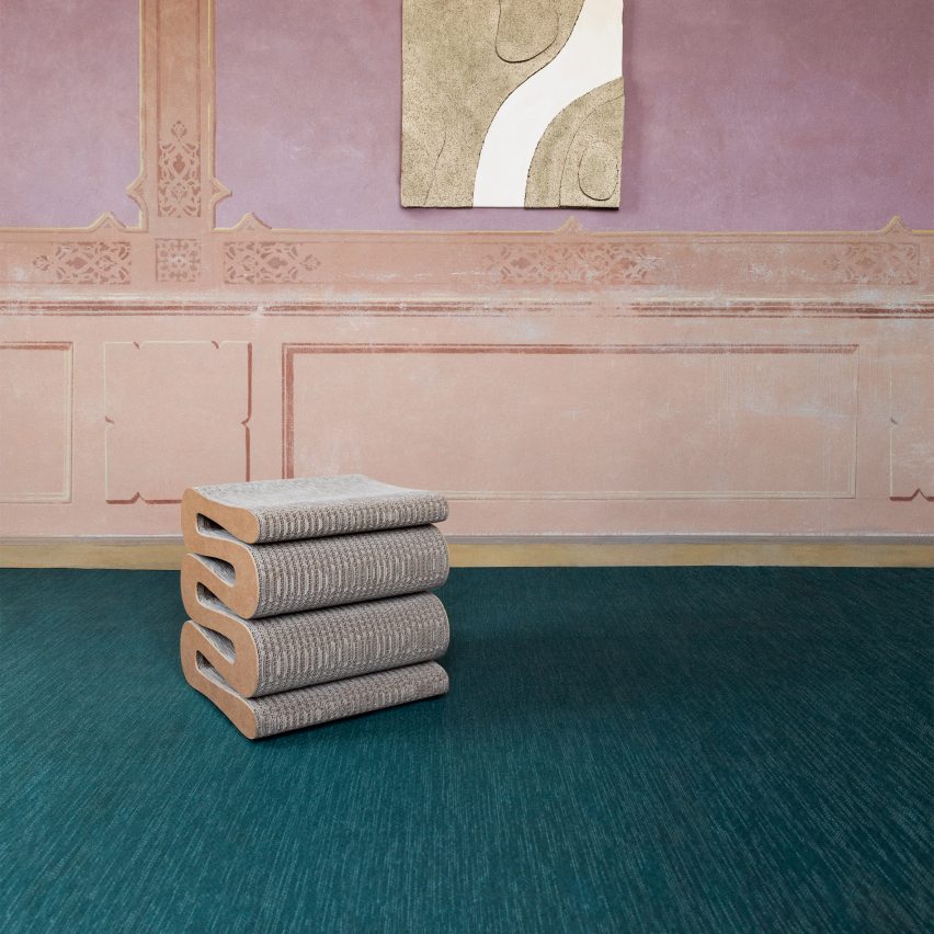Bolon teal woven flooring in a pink room with a sculptural stool