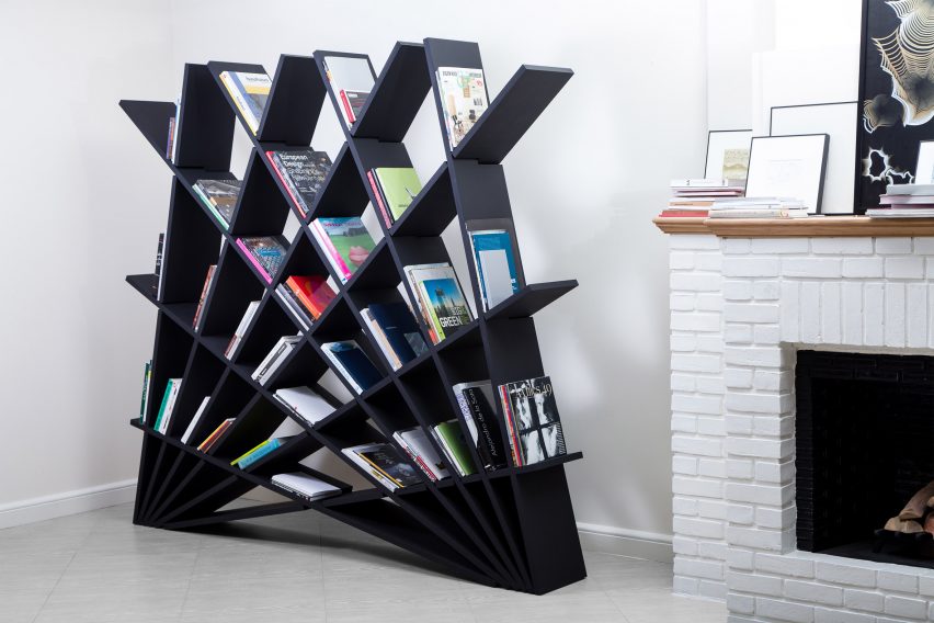 Black Cheft bookcase next to a fireplace in a white living room