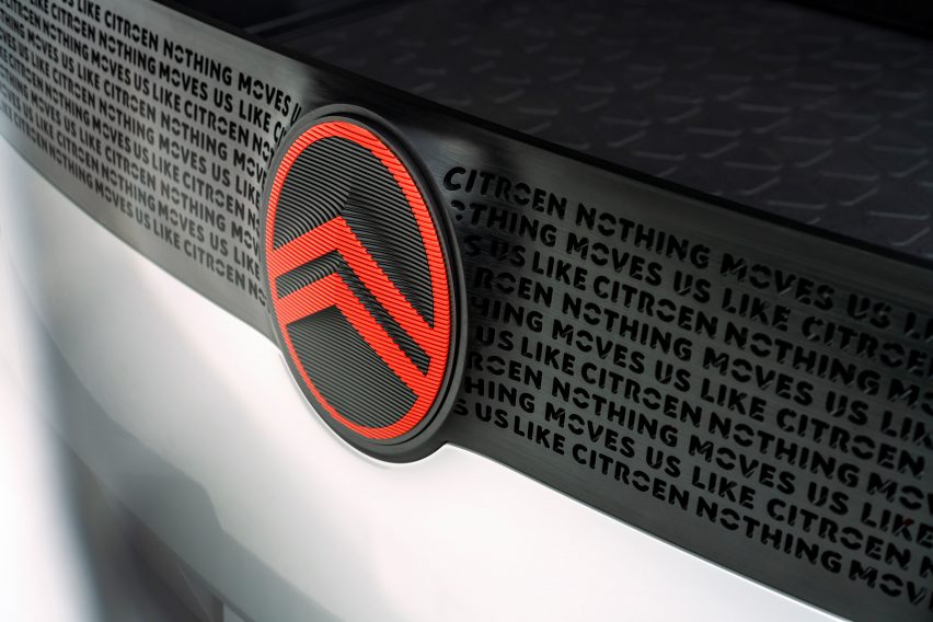 A red Citroen logo on a black car
