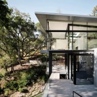 Dezeen Debate newsletter features an "ostentatious" house spanning a California creek