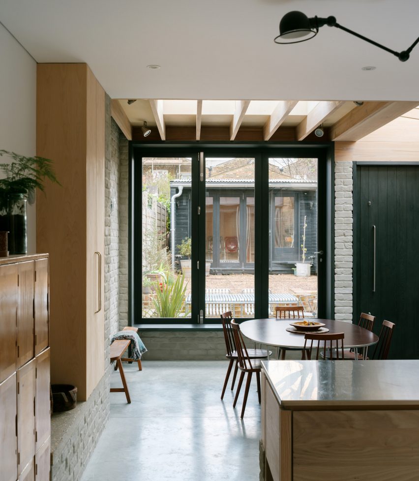 Kitchen with polished concrete floor and wooden joinery