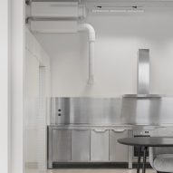 Steel kitchen and white perforated steel walls indesign studio
