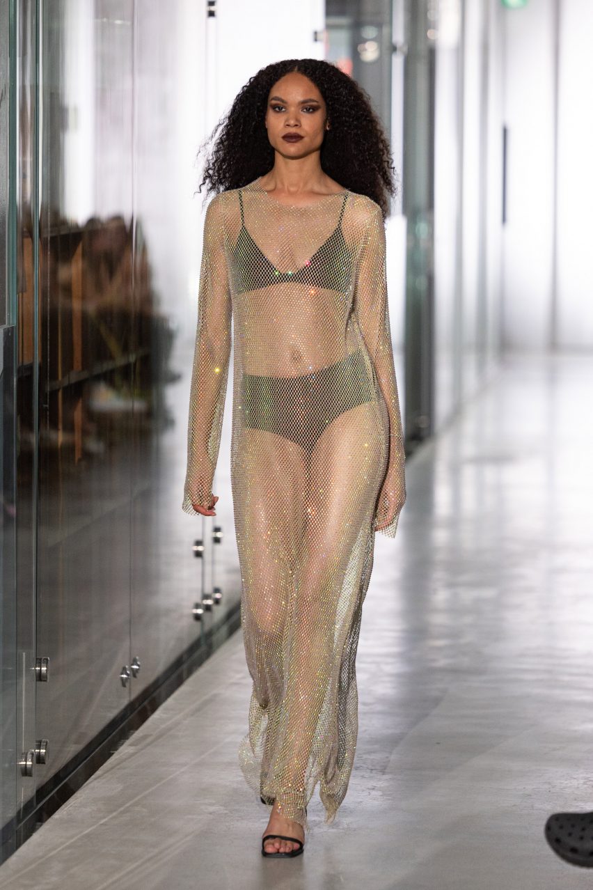 Image of a model wear a sheer rhinestoned Francon dress