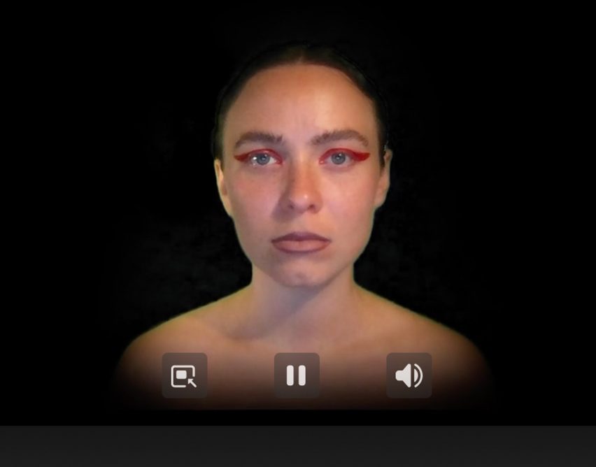 Still from a video of a person on a black background