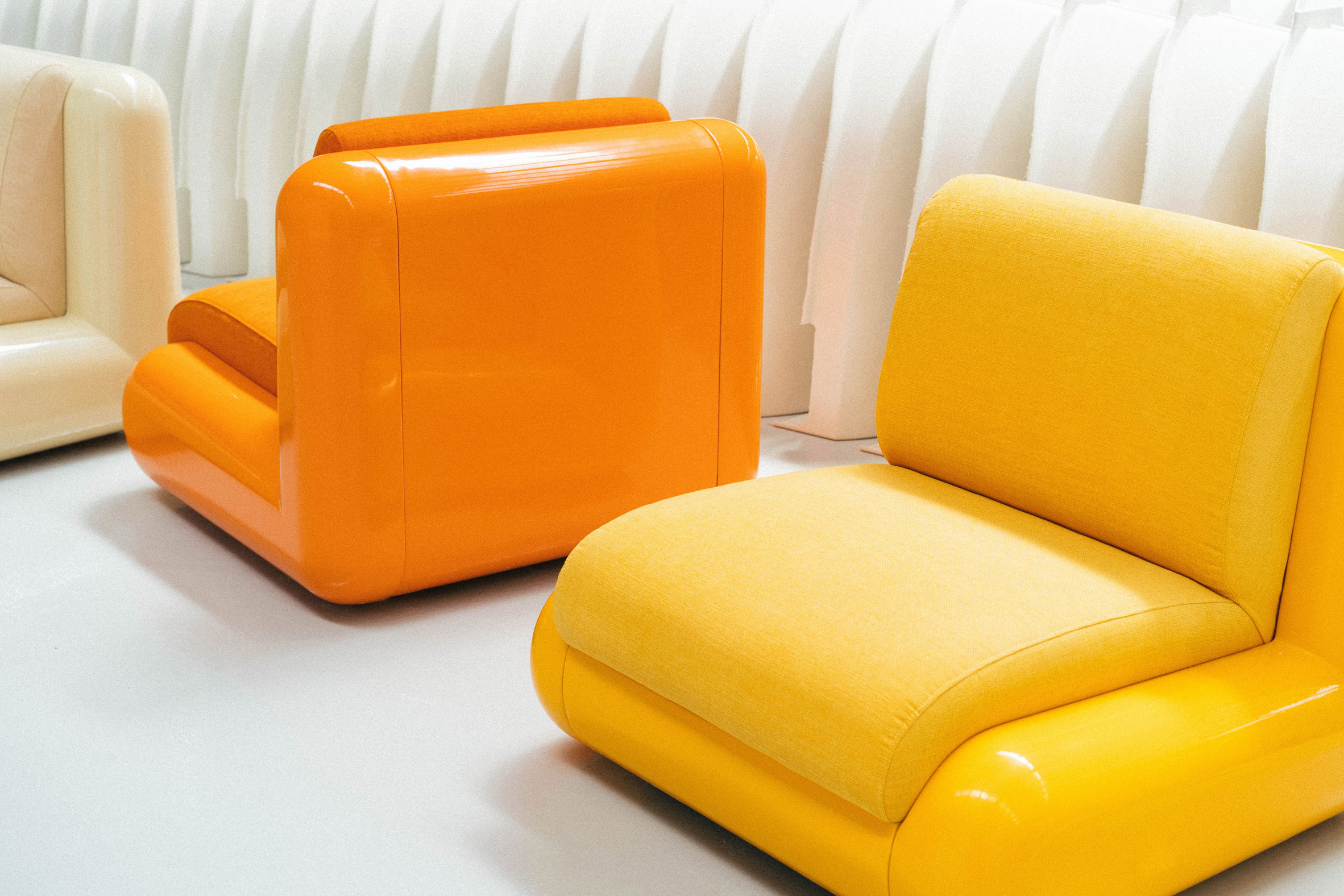 A yellow and an orange chair by Holloway Li