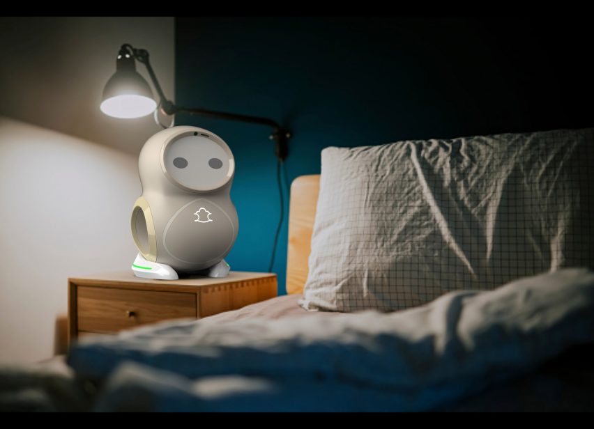 Photograph showing bedside table with robot and lamp