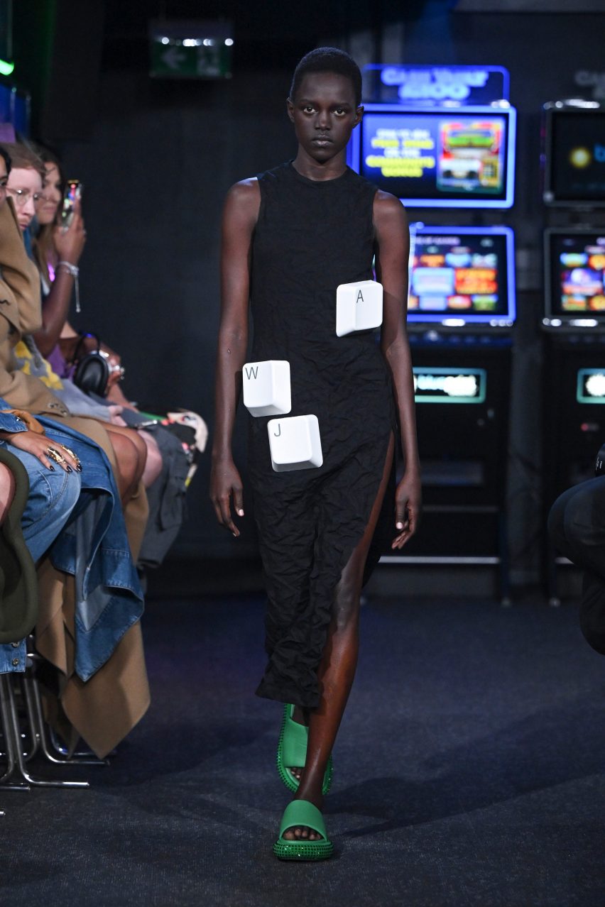 A model wears a dress emblazoned with computer keys at JW Anderson Spring Summer 2023.