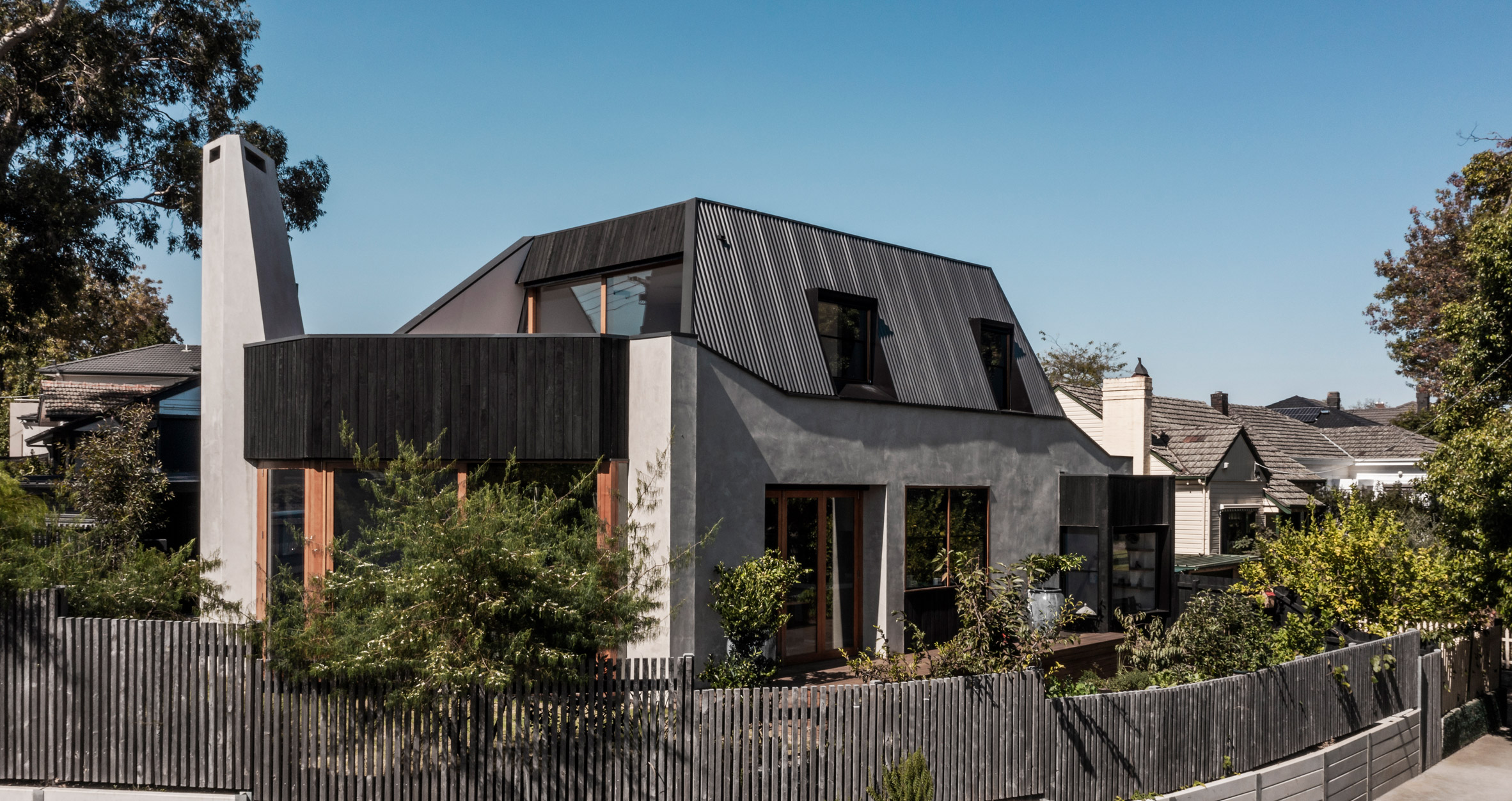 Black and grey exterior of Keep House by BKK Architects