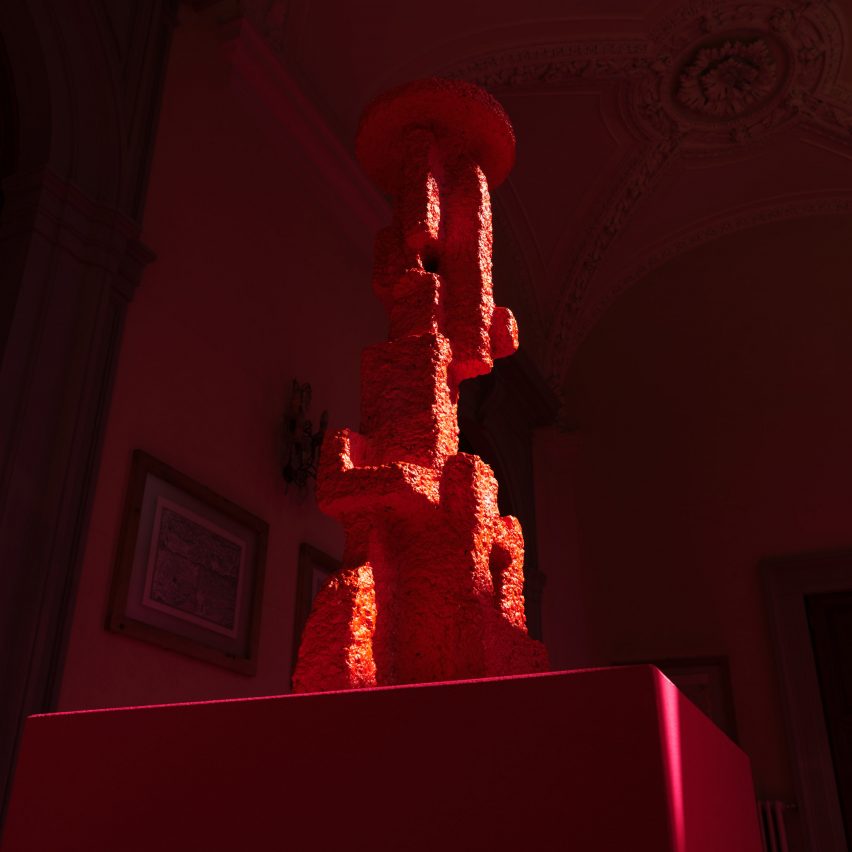 A red totemic sculpture