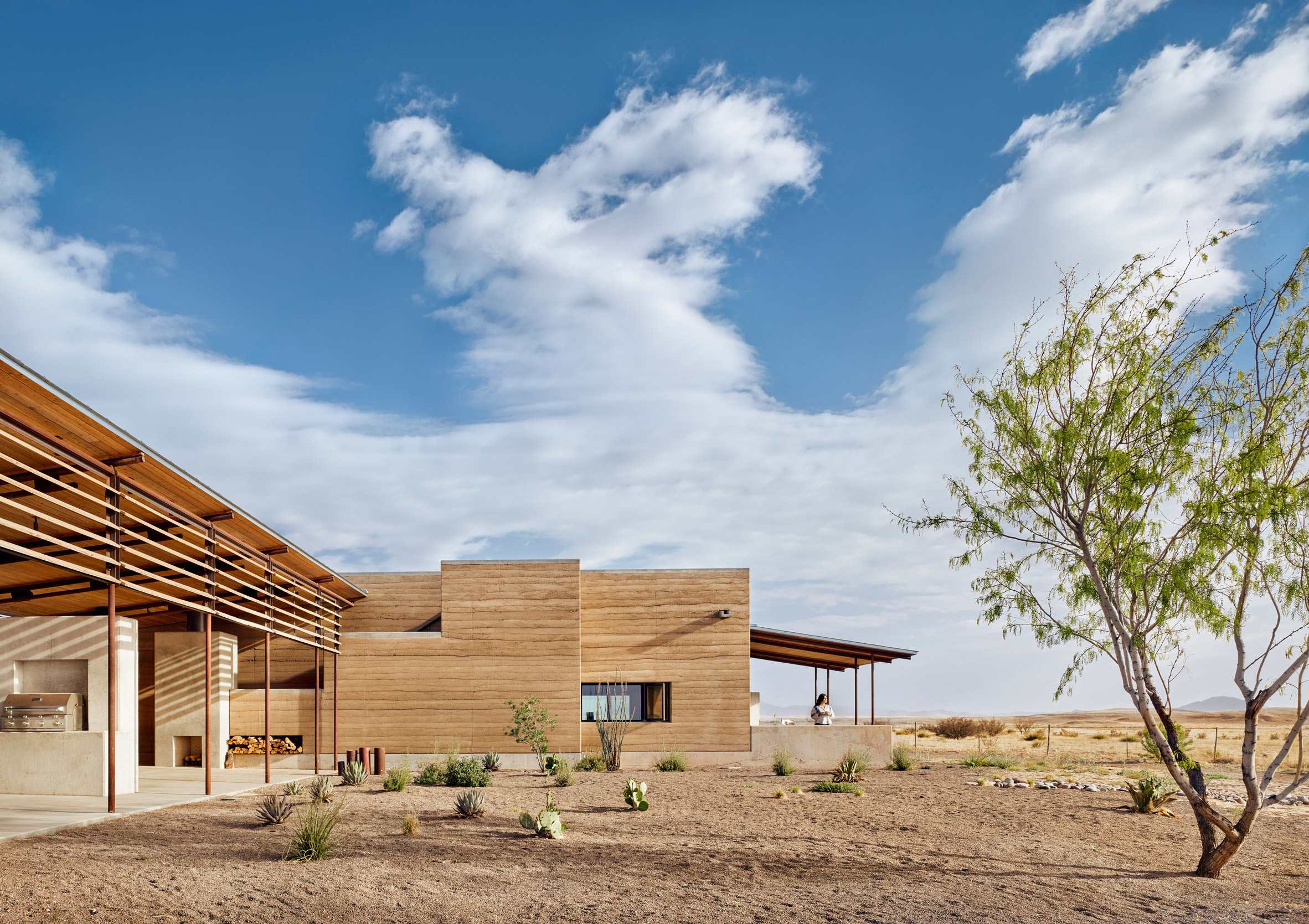 Marfa Ranch house with rammed earth walls in Texas desert by Lake Flato