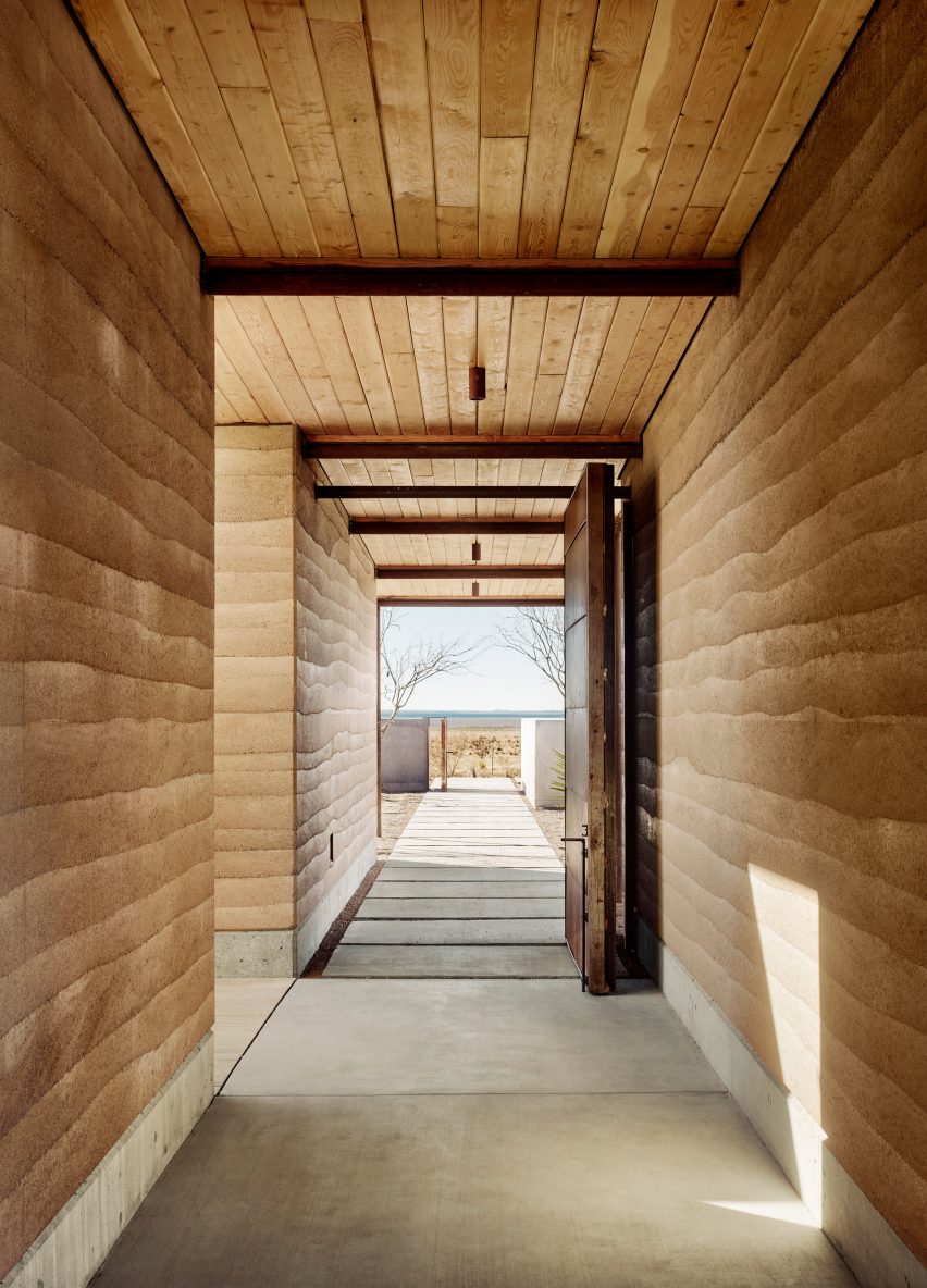 Rammed earth corridors in Marfa Ranch by Lake Flato Architects