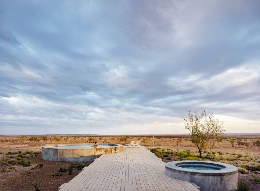 Water tank on boardwalk converted into swimming pool in Texas desert
