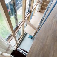 Looking down into piano, Light-Filled Stair Hall by Kiri Architects
