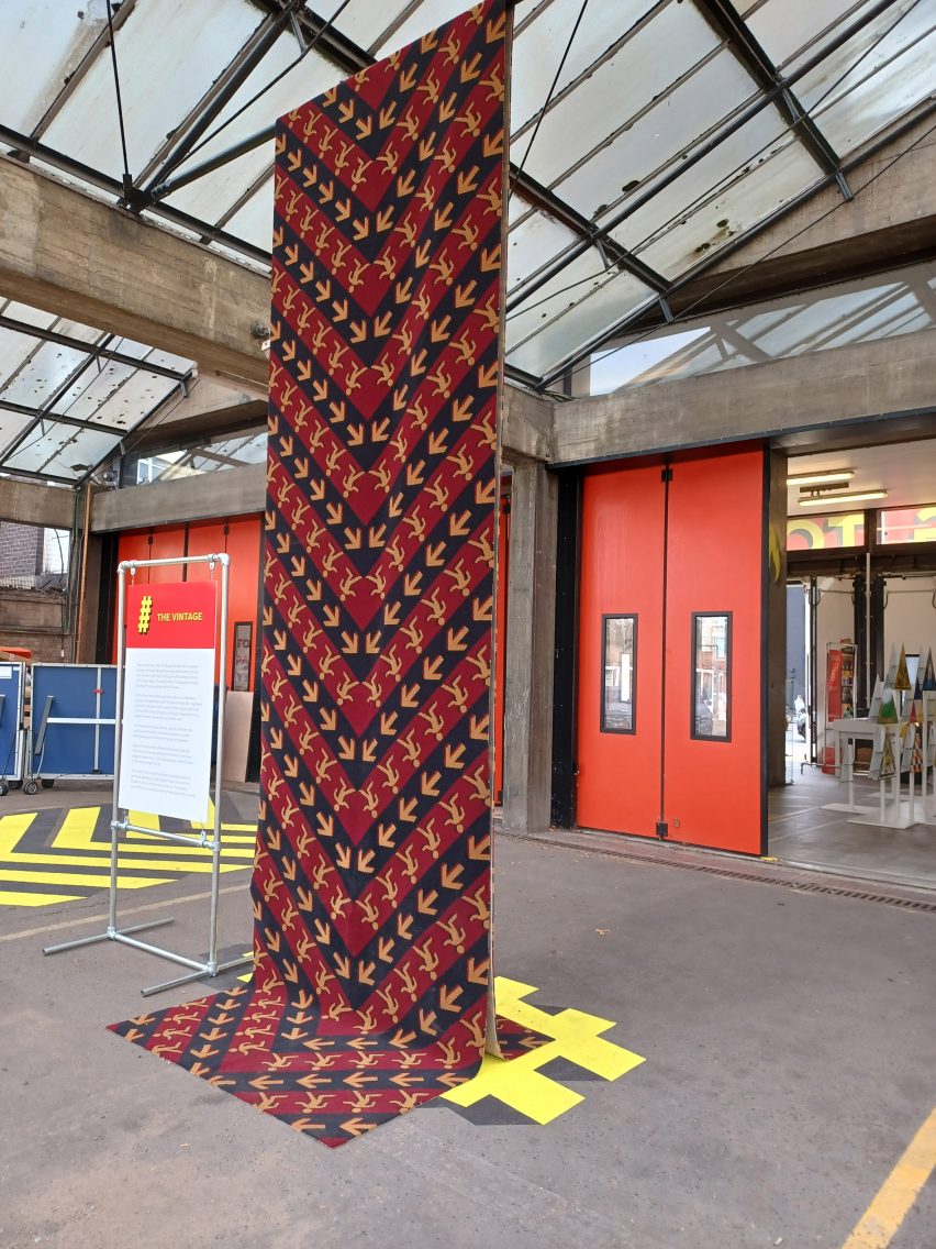 Rug hanging from beams at Shoreditch Fire Station