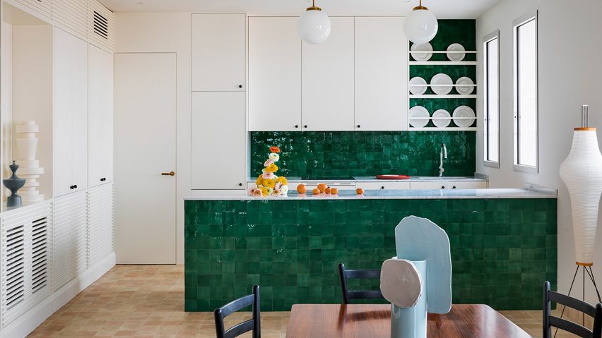 Green-tiled kitchen in Conde Duque apartment by Sierra + De La Higuera
