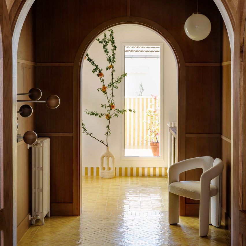 Wood-paneled hallway in Conde Duque Apartments by Sierra + de la Higuera