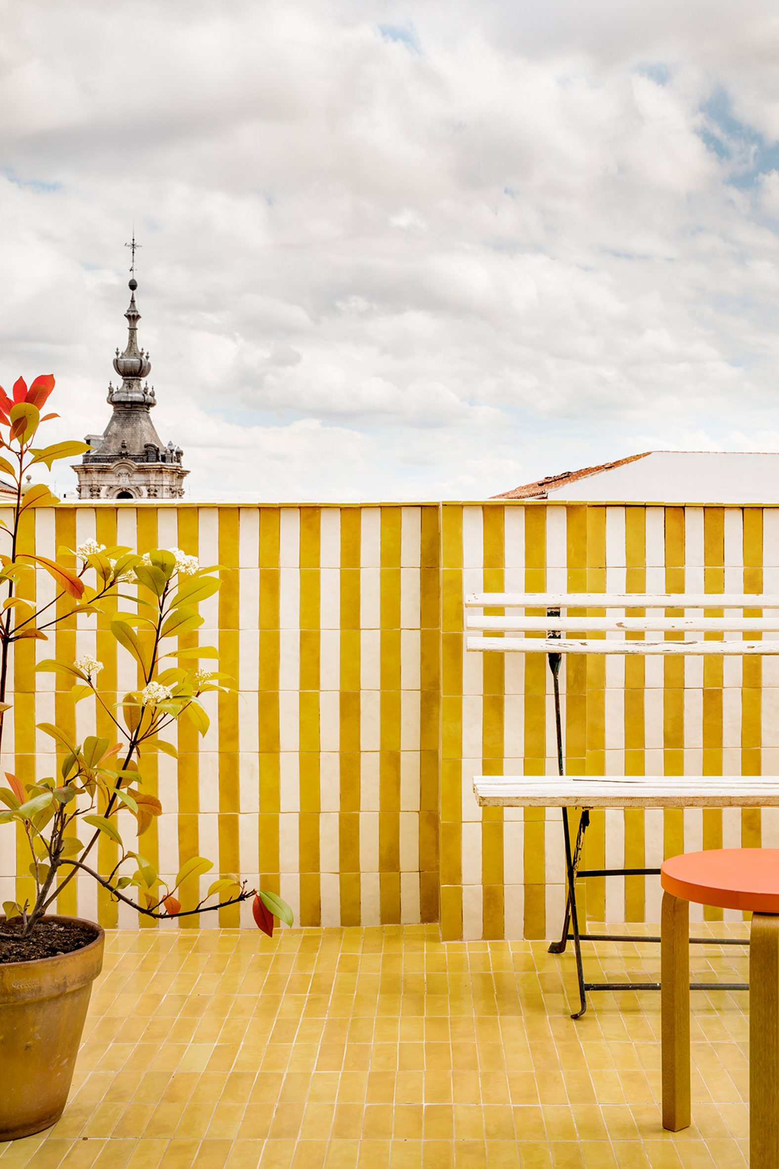 Terrace with yellow-and-white tiles in Conde Duque apartment
