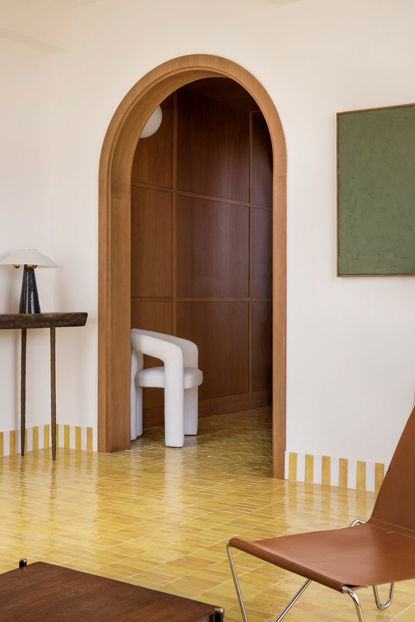 Curved, wood-panelled doorway in Conde Duque apartment 