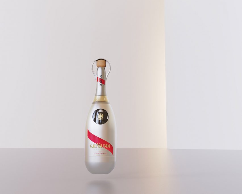 A silver champagne bottle on a pastel background