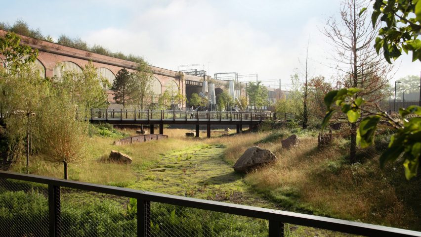 Photograph of a park featuring a steel bridge 