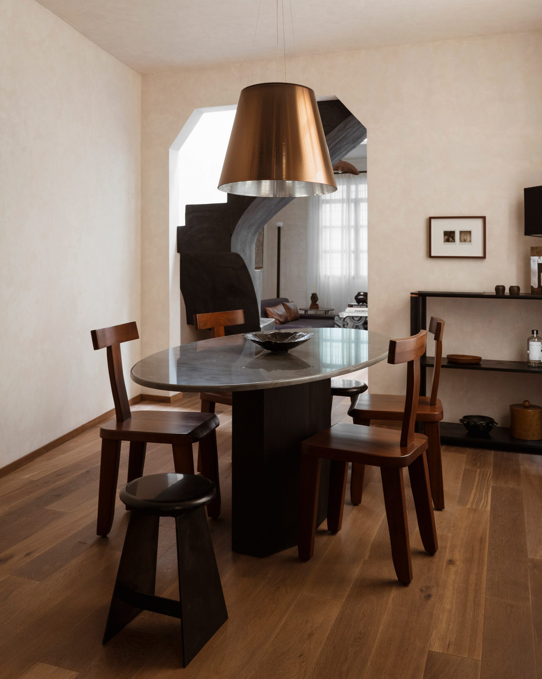 Dining room with mismatched dark wood furniture