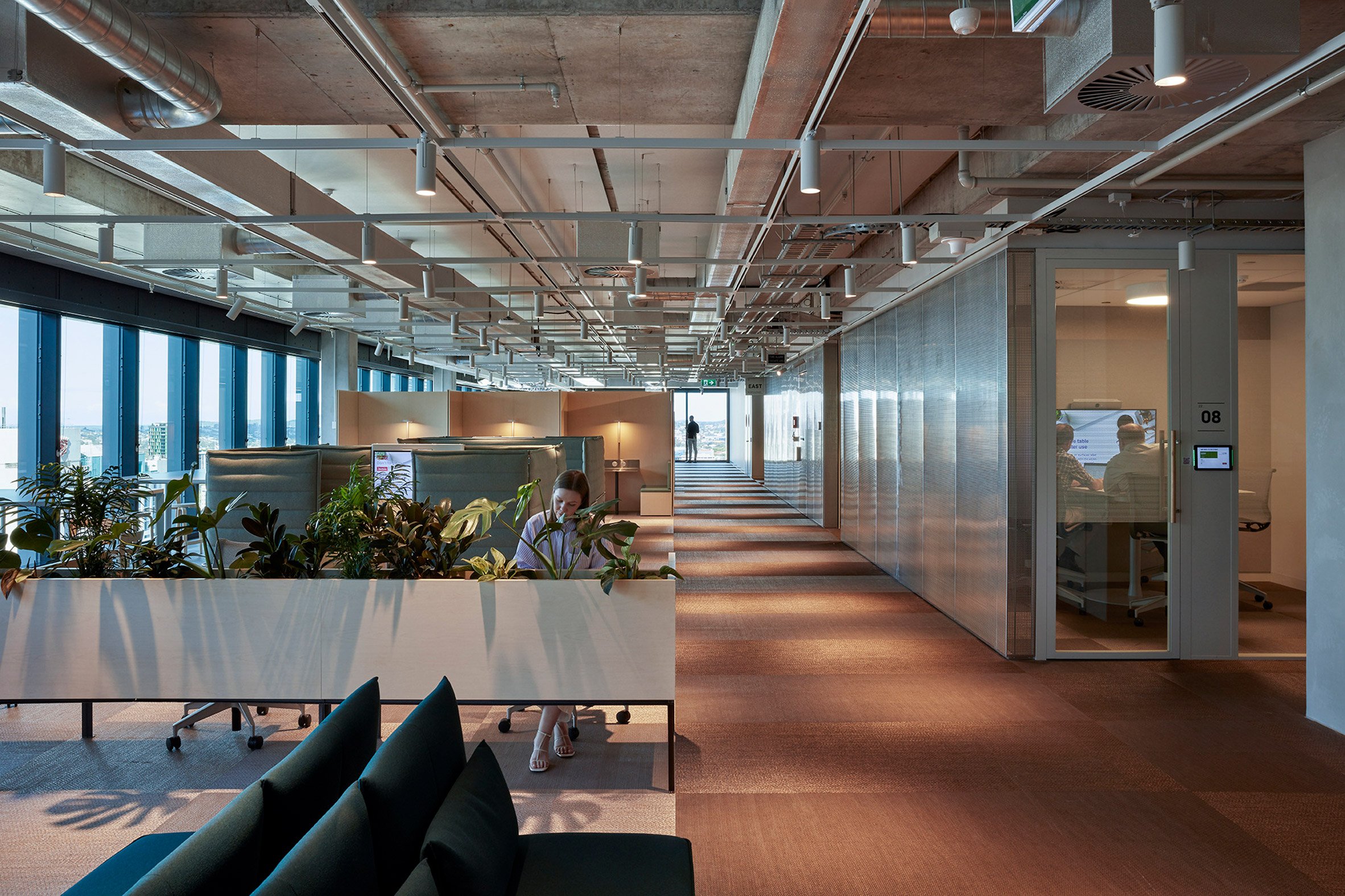 Office interior with exposed concrete ceilings and metalwork