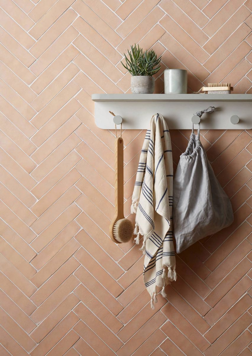 Clay rectangle tiles from New Terracotta on a wall in a parquet pattern