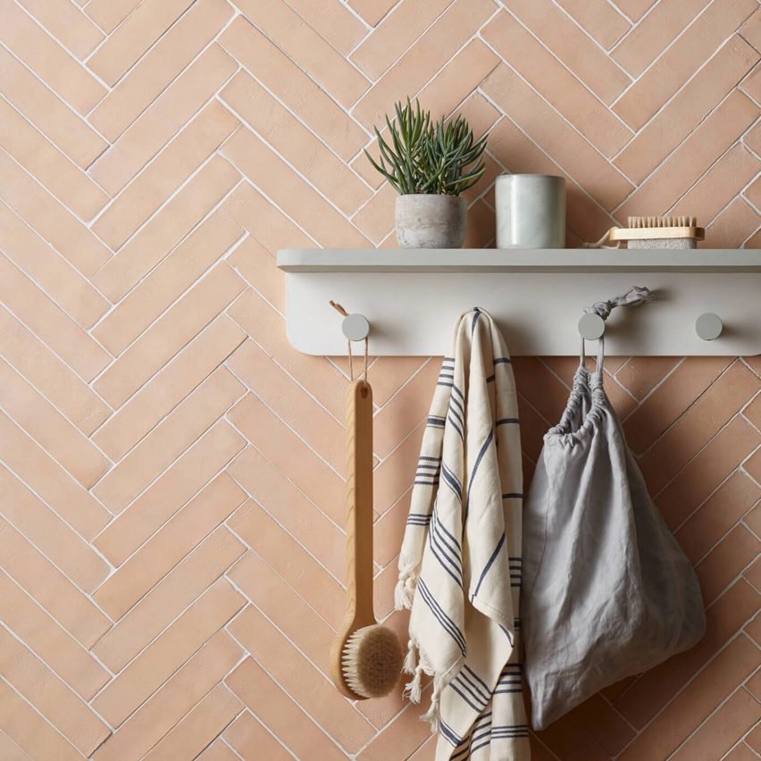 Rectangular terracotta tiles from New Terracotta on a wall in a parquet pattern