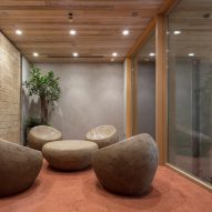 Nori Architects uses natural materials and cedar log columns to retrofit Japanese office