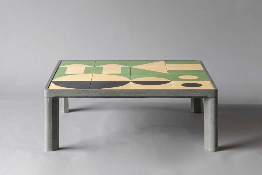A tiled table with a green pattern