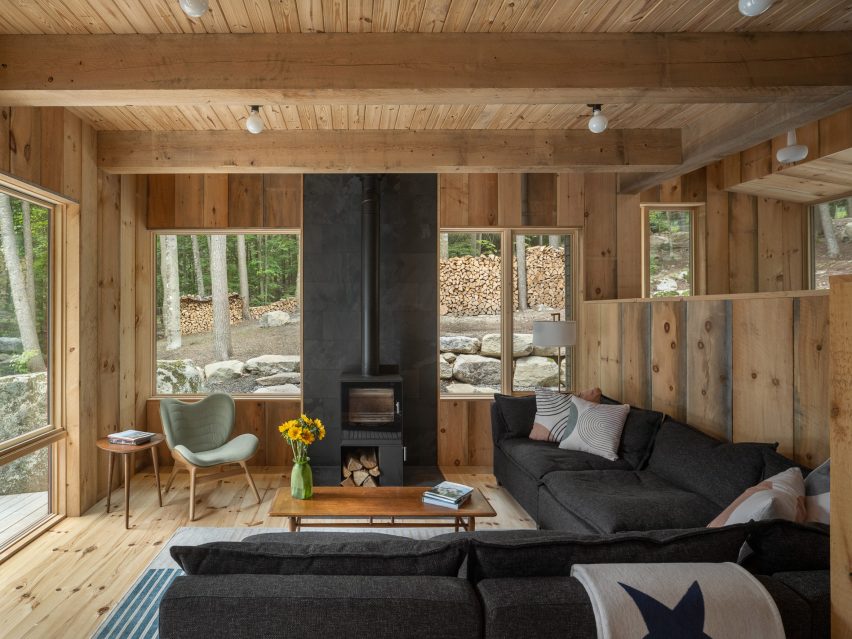 Wood burning stove in a modern Maine cabin with modern accents