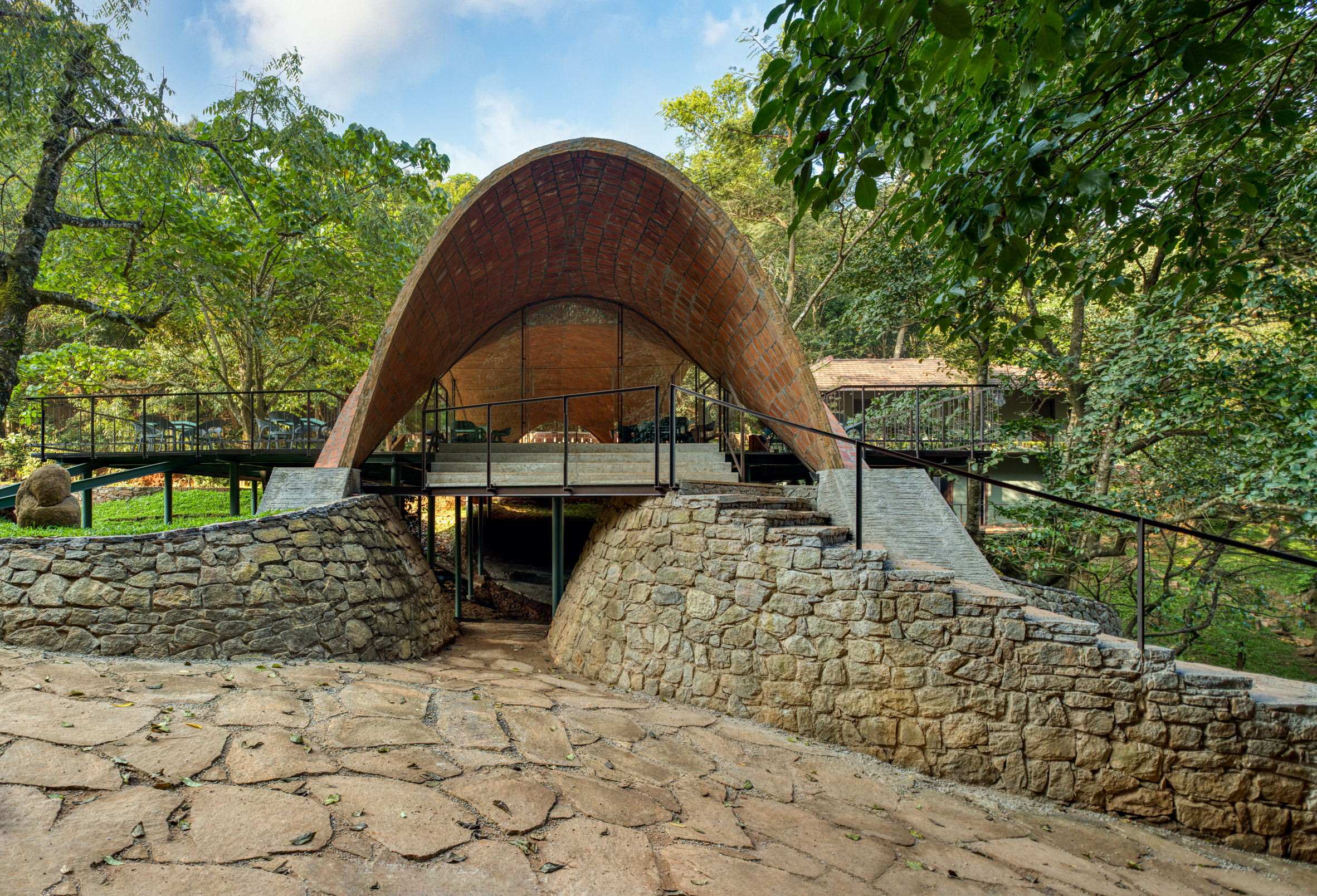 Raised restaurant in India topped with a tile vault by Play Architecture