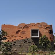 Exterior image of Gadi House and its wavy brick facade