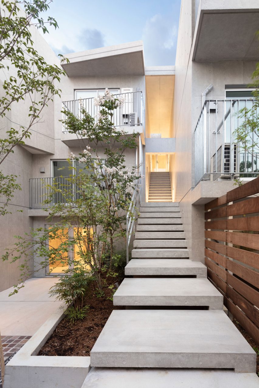 Concrete exterior staircase leading to apartments